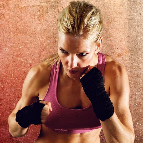 Mixed Martial Arts Lessons for Adults in Ashburn VA - Lady Kickboxing Focused Background